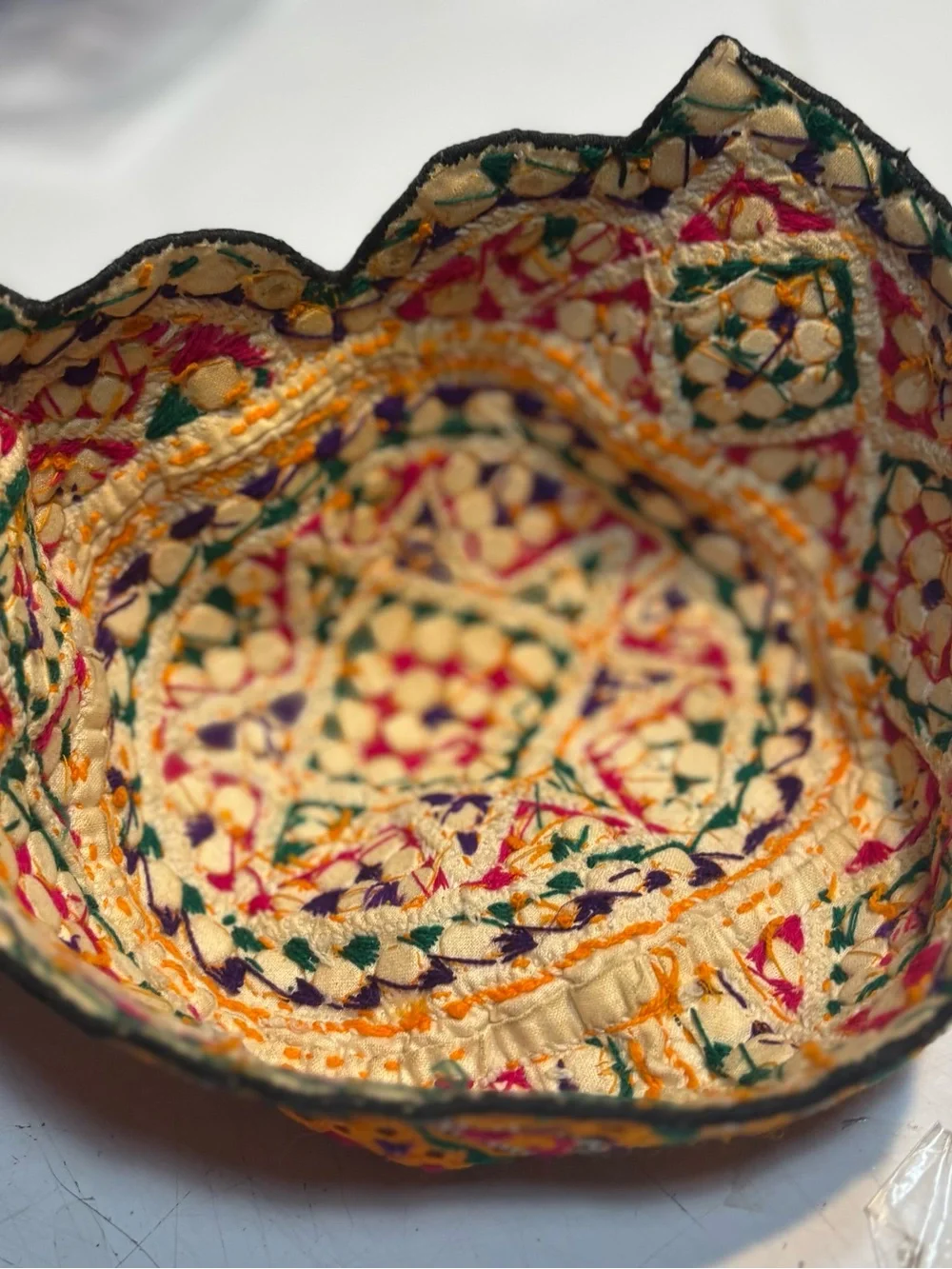 traditional handmade Balochi or Bugti cap featuring vibrant yellow embroidery